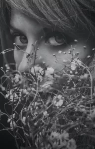 A woman smelling flowers