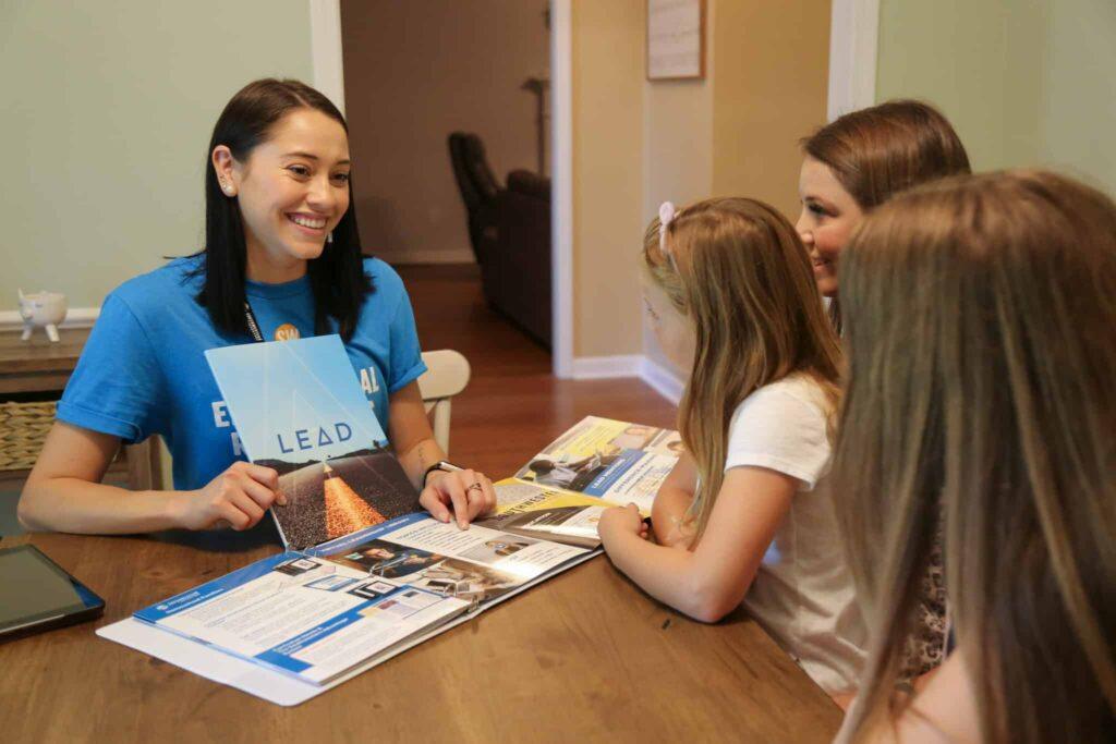 Kids getting help from a representative.