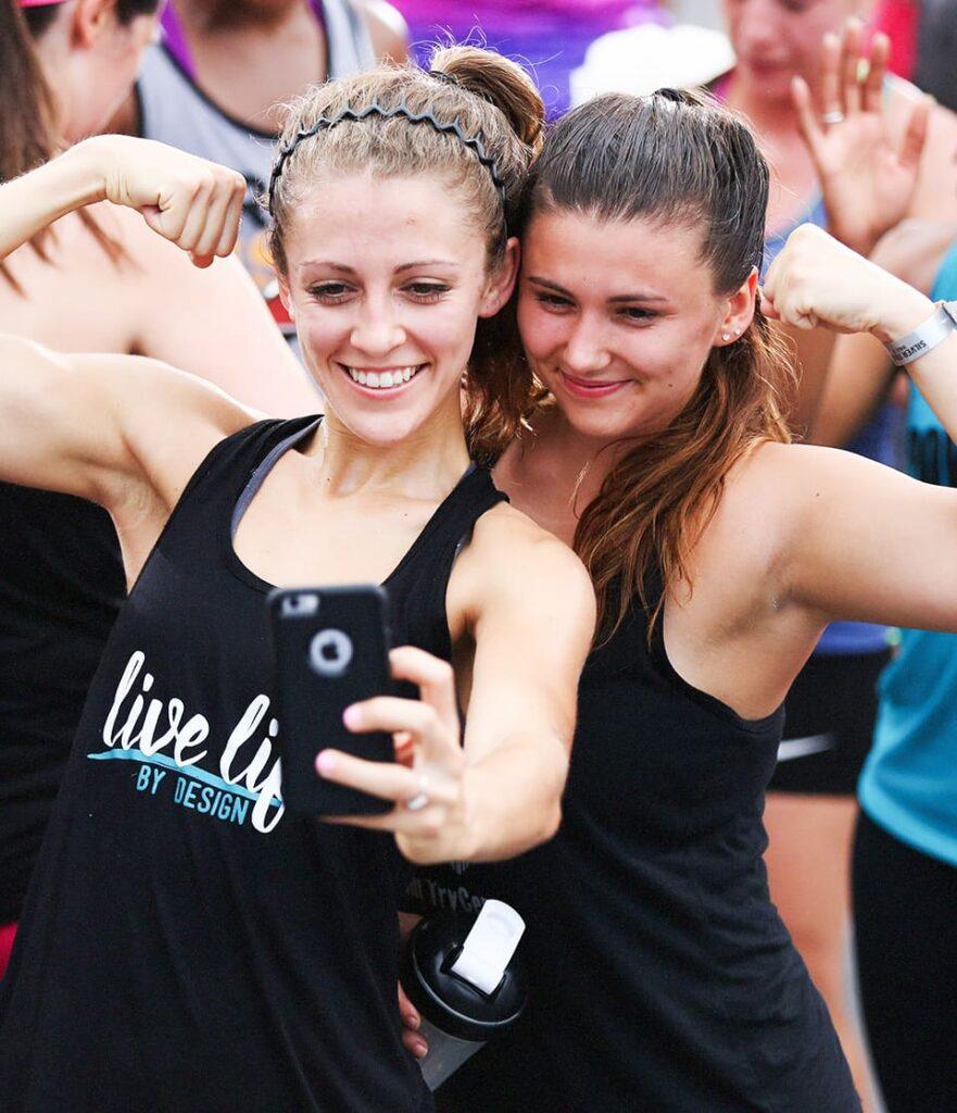 A woman training another woman about physical fitness.