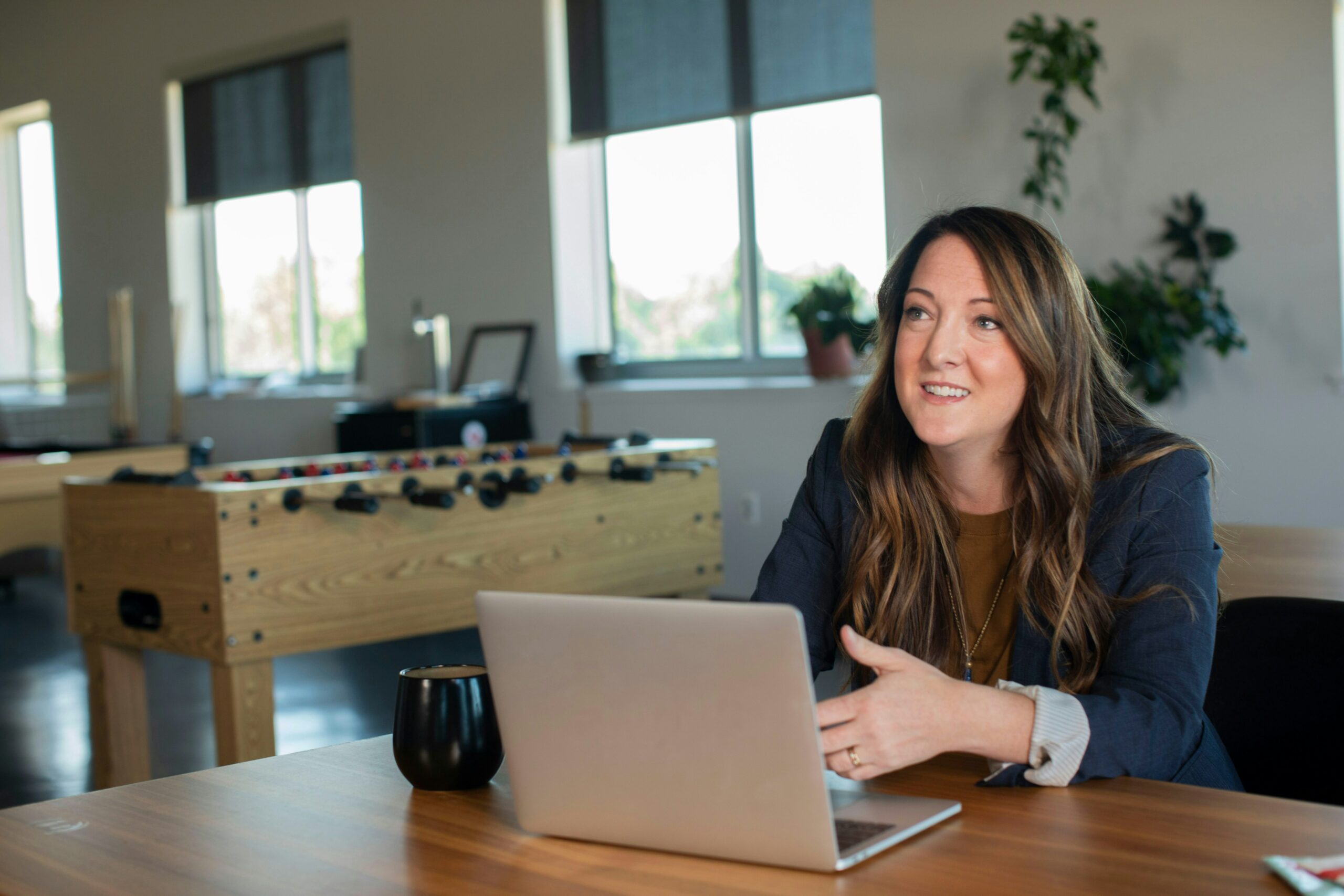 A young woman working on her marketing on her laptop computer.